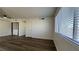 Bright, open living area with hardwood floors and a laundry closet at 567 Roxella Ln # D, Las Vegas, NV 89110