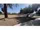 Large grassy field with shade trees and parked cars on the roadside at 567 Roxella Ln # D, Las Vegas, NV 89110