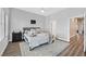 Comfortable bedroom featuring a cozy bed, soft lighting, and wood-style flooring at 6434 Spring Jog St, Las Vegas, NV 89166