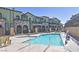 Gorgeous community pool with a spa and nearby seating at 6434 Spring Jog St, Las Vegas, NV 89166