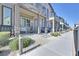 Desirable neighborhood featuring a row of townhouses with charming front porches at 6434 Spring Jog St, Las Vegas, NV 89166