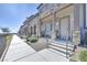 Charming townhouse exterior with stone accents, covered porch, and well-maintained landscaping at 6434 Spring Jog St, Las Vegas, NV 89166
