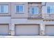Charming townhome featuring a two-car garage with stone accents at 6434 Spring Jog St, Las Vegas, NV 89166