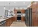 Stylish kitchen with stainless steel appliances, sleek countertops, and modern cabinets at 6434 Spring Jog St, Las Vegas, NV 89166