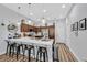 Modern kitchen with stylish bar seating, stainless steel appliances, and ample counter space at 6434 Spring Jog St, Las Vegas, NV 89166