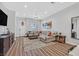 Comfortable living room featuring an open layout, plush sectional, and stylish decor at 6434 Spring Jog St, Las Vegas, NV 89166