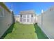 Backyard with a well-maintained shed on artificial turf, perfect for storage at 645 Utah St, Boulder City, NV 89005