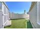 Backyard featuring a storage shed with ample green space and privacy fencing at 645 Utah St, Boulder City, NV 89005