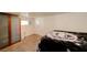 Neutral bedroom with carpeted floors and a unique sliding door closet at 645 Utah St, Boulder City, NV 89005