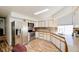 Well-lit kitchen featuring stainless steel appliances, light countertops, and wood-look flooring at 645 Utah St, Boulder City, NV 89005