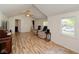 Open living area featuring wood floors and ample natural light from large windows at 645 Utah St, Boulder City, NV 89005