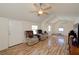 Bright living room with vaulted ceilings, wood floors, and a cozy seating area at 645 Utah St, Boulder City, NV 89005