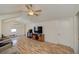 Comfortable living room featuring wood floors and a ceiling fan with light at 645 Utah St, Boulder City, NV 89005