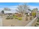 Charming single-story home featuring a covered parking area and desert landscaping for low maintenance at 657 Burton St, Henderson, NV 89015