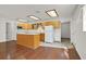 An open kitchen with light wood cabinetry, an island, and modern appliances for cooking convenience at 657 Burton St, Henderson, NV 89015