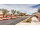The community's gated entrance features mature trees and desert landscaping at 6904 Baylor Creek St, North Las Vegas, NV 89086