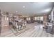 Expansive open-concept living area with dining space, stylish flooring, recessed lighting, and abundant natural light at 6904 Baylor Creek St, North Las Vegas, NV 89086