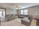 Upstairs living room with a sectional sofa, reclining chairs, natural light, and a cozy atmosphere for relaxation and entertainment at 6904 Baylor Creek St, North Las Vegas, NV 89086