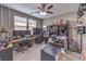Home office featuring dual-monitor setup, neutral-toned walls, and functional shelving for optimal organization and productivity at 6904 Baylor Creek St, North Las Vegas, NV 89086