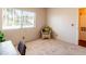 Bright bedroom featuring a sunny window and a cozy wicker chair at 7061 Roscoe Ave # 201, Las Vegas, NV 89129