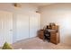 Bedroom with a desk area, large closet, and overhead storage at 7061 Roscoe Ave # 201, Las Vegas, NV 89129
