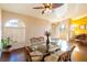 Bright dining room features a glass table and decorative ceiling fan at 7061 Roscoe Ave # 201, Las Vegas, NV 89129