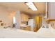 Well-lit kitchen features plenty of counter space, light wood cabinets, and modern appliances for easy meal preparation at 7061 Roscoe Ave # 201, Las Vegas, NV 89129