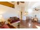 Open concept living and dining area with wood floors and natural light at 7061 Roscoe Ave # 201, Las Vegas, NV 89129