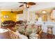 Open-concept living space, with dining area and kitchen; hardwood floors at 7061 Roscoe Ave # 201, Las Vegas, NV 89129
