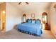 Inviting main bedroom featuring soft carpeting, a large bed with decorative pillows, and well-crafted wooden furniture at 7061 Roscoe Ave # 201, Las Vegas, NV 89129