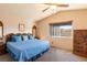 Comfortable main bedroom with a large bed, ample natural light, and matching wooden furniture, creating a relaxing retreat at 7061 Roscoe Ave # 201, Las Vegas, NV 89129