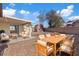 Backyard with patio seating and dining area; a virtually staged outdoor retreat at 7138 Sixshooter Dr, Las Vegas, NV 89119