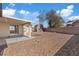 Backyard with patio, shed, and brick wall; an outdoor retreat awaits at 7138 Sixshooter Dr, Las Vegas, NV 89119
