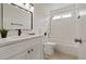 Bright bathroom featuring a tub, shower, and a modern vanity with elegant countertops at 7138 Sixshooter Dr, Las Vegas, NV 89119