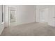 Spacious bedroom featuring plush carpeting and ample natural light at 7138 Sixshooter Dr, Las Vegas, NV 89119