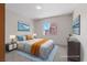 Staged bedroom offering natural light, carpet, and decor at 7138 Sixshooter Dr, Las Vegas, NV 89119
