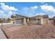 One-story home featuring a two-car garage and a charming stucco exterior at 7138 Sixshooter Dr, Las Vegas, NV 89119