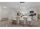 Bright, remodeled kitchen features white cabinets, an island, and stainless steel appliances at 7138 Sixshooter Dr, Las Vegas, NV 89119