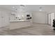 Bright kitchen with white cabinets, stainless steel appliances, and spacious island at 7138 Sixshooter Dr, Las Vegas, NV 89119