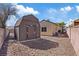 Backyard shed featuring durable siding and a double door for easy access at 7138 Sixshooter Dr, Las Vegas, NV 89119