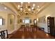 Elegant dining room with chandelier, classic furniture, and wood floors at 7325 Rustic Crest St, Las Vegas, NV 89149