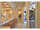 Hallway features built-in cabinets, tiled floors, neutral walls, and recessed lighting at 7325 Rustic Crest St, Las Vegas, NV 89149