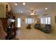 Comfortable living room with tile flooring, fireplace, built-ins, and sunlit windows at 7325 Rustic Crest St, Las Vegas, NV 89149