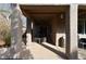 Covered patio featuring ceiling fan, textured columns, and outdoor seating at 7325 Rustic Crest St, Las Vegas, NV 89149