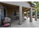 Inviting covered patio with a ceiling fan, seating area, and space for a grill at 7325 Rustic Crest St, Las Vegas, NV 89149