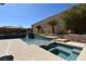 Inviting pool area with a tranquil waterfall feature, offering a serene outdoor retreat at 7325 Rustic Crest St, Las Vegas, NV 89149