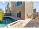 Inviting pool area featuring a fire pit, tropical landscaping, and ample lounging space at 8116 Haywood Estate Ave, Las Vegas, NV 89113
