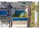 A modern backyard featuring a rectangular pool, sleek patio furniture, and a well-manicured lawn at 8116 Haywood Estate Ave, Las Vegas, NV 89113
