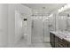 Bright bathroom featuring a glass shower, granite vanity, and modern fixtures at 8116 Haywood Estate Ave, Las Vegas, NV 89113