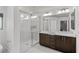 Bathroom features a walk-in shower, double sinks and a large mirror at 8116 Haywood Estate Ave, Las Vegas, NV 89113